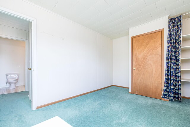 10989 Seminole Shore Dr, Huntsville, OH 43324 - unfurnished bedroom featuring carpet flooring and ornamental molding