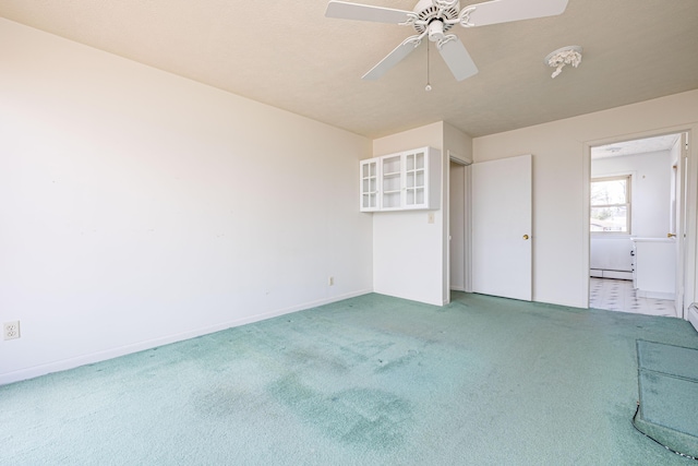 10989 Seminole Shore Dr, Huntsville, OH 43324 - unfurnished bedroom with a baseboard heating unit, light colored carpet, baseboards, and ceiling fan