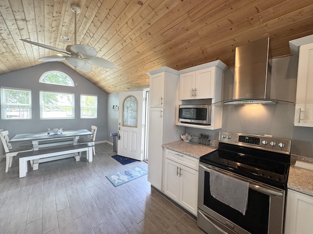 13864 Public Dr, Lakeview, OH 43331 - kitchen featuring stainless steel appliances, wall chimney range hood, wood ceiling, a ceiling fan, and white cabinets