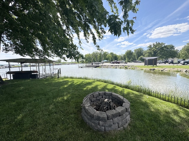 13864 Public Dr, Lakeview, OH 43331 - view of grassy yard featuring a fire pit and a water view