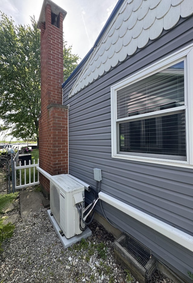 13864 Public Dr, Lakeview, OH 43331 - view of side of home with a cooling unit