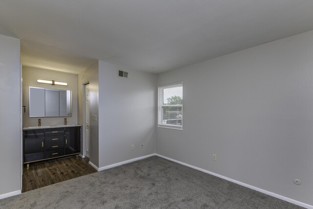 3112 Legend Way, Dayton, OH 45449 - unfurnished bedroom with dark colored carpet and ensuite bathroom
