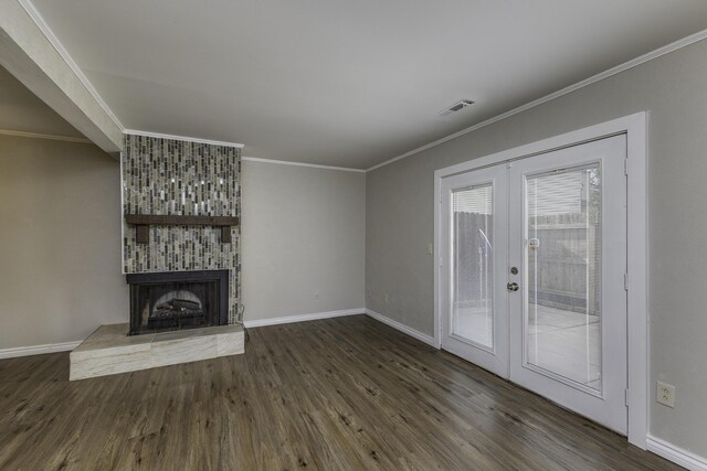 3112 Legend Way, Dayton, OH 45449 - unfurnished living room featuring french doors, wood finished floors, ornamental molding, and a large fireplace