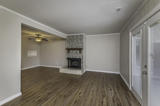3112 Legend Way, Dayton, OH 45449 - unfurnished living room featuring dark wood-type flooring, crown molding, a stone fireplace, and ceiling fan