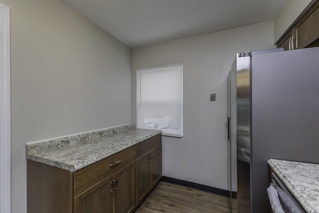 3112 Legend Way, Dayton, OH 45449 - kitchen featuring freestanding refrigerator, dark wood-style flooring, light countertops, and dark brown cabinets