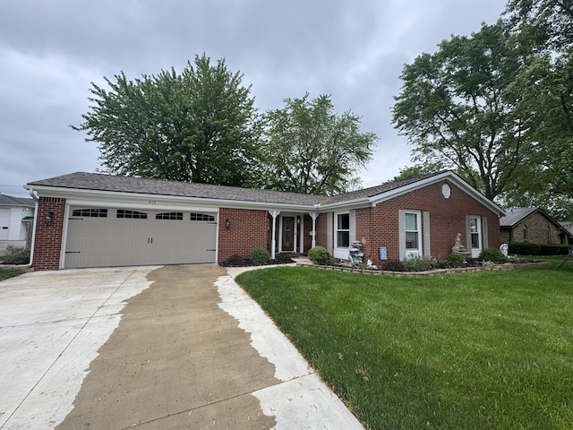 612 S Main St, Saint Marys, OH 45885 - ranch-style home with brick siding, an attached garage, driveway, and a front yard