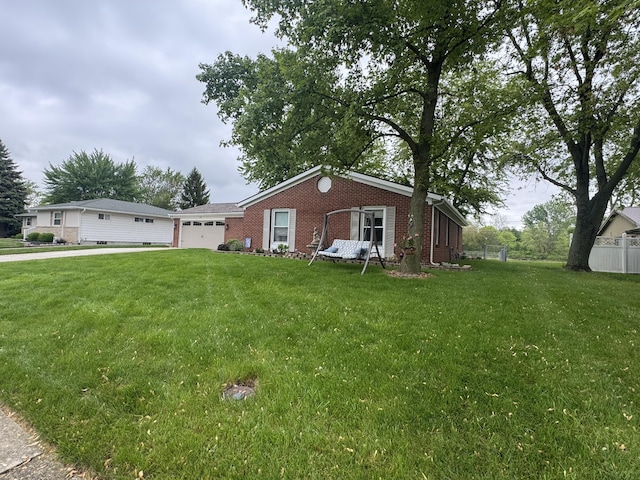 612 S Main St, Saint Marys, OH 45885 - view of front facade featuring brick siding, a garage, and driveway
