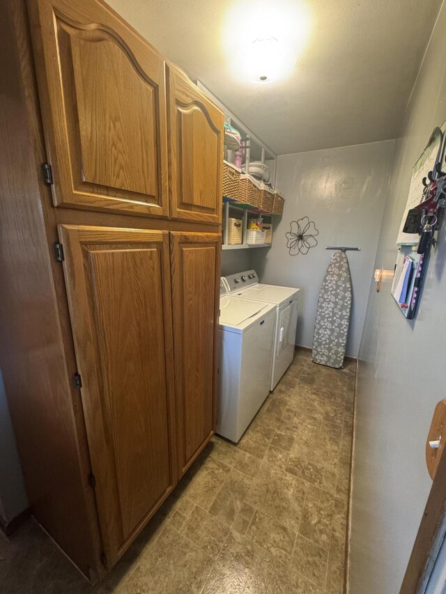 612 S Main St, Saint Marys, OH 45885 - laundry room featuring cabinet space, washer and dryer, and stone finish floors