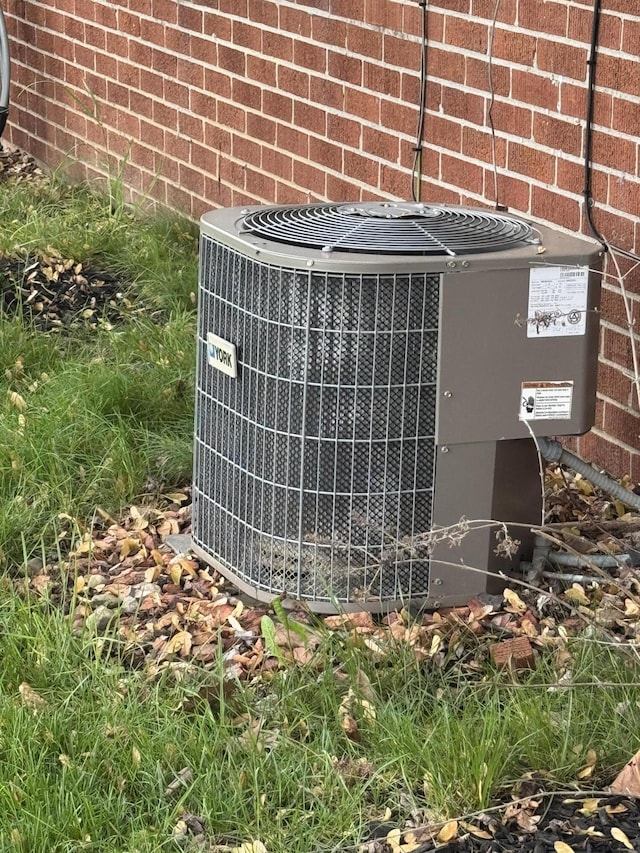 612 S Main St, Saint Marys, OH 45885 - exterior view of central air condition unit and brick siding