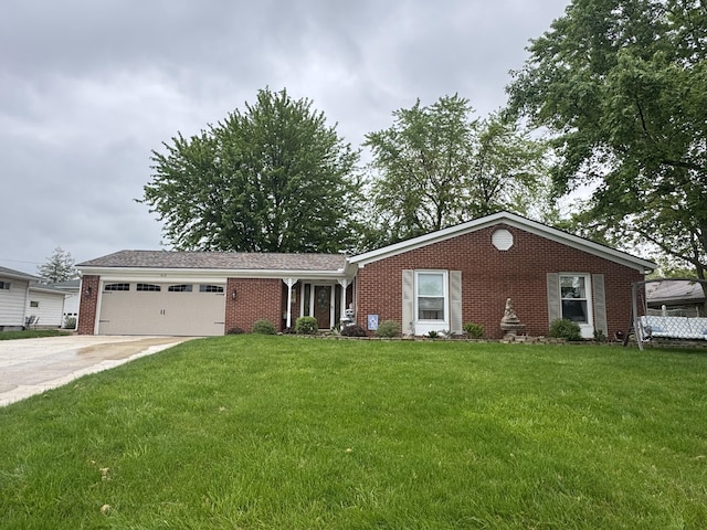 612 S Main St, Saint Marys, OH 45885 - ranch-style home featuring an attached garage, brick siding, driveway, and a front yard