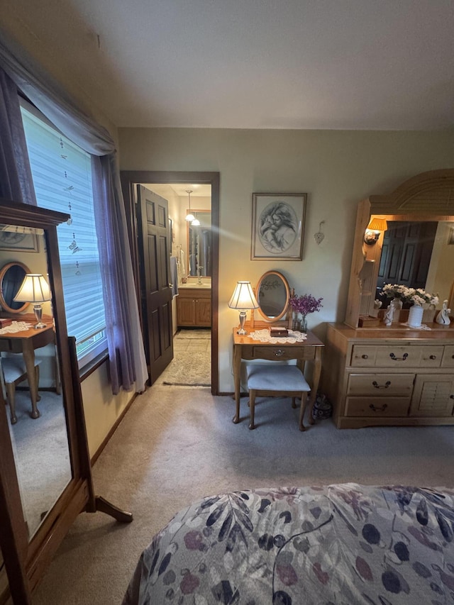 612 S Main St, Saint Marys, OH 45885 - bedroom with light colored carpet, an office area, and ensuite bath