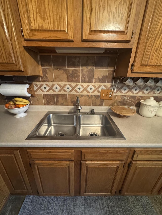 612 S Main St, Saint Marys, OH 45885 - kitchen with a sink, light countertops, and brown cabinetry