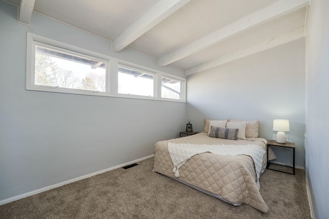 bedroom with lofted ceiling with beams, carpet flooring, visible vents, and baseboards