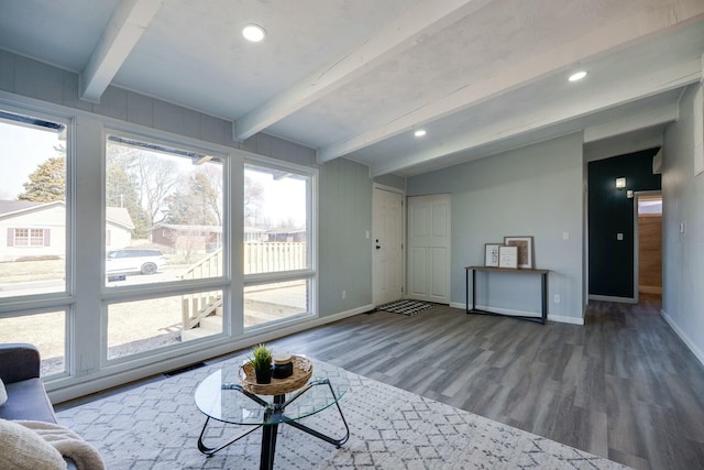 living room featuring wood finished floors, baseboards, visible vents, beam ceiling, and recessed lighting