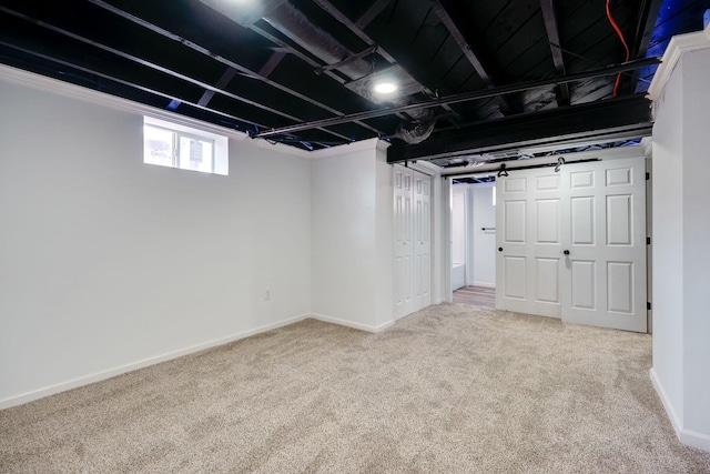 below grade area featuring baseboards and carpet floors