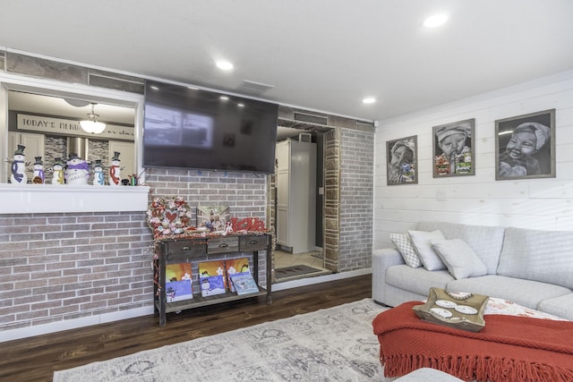 living room with a fireplace and hardwood / wood-style floors