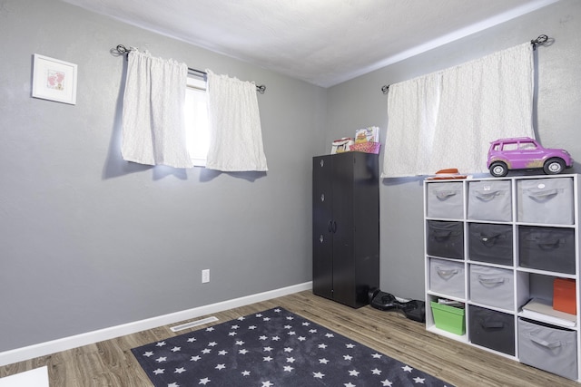 interior space with hardwood / wood-style floors