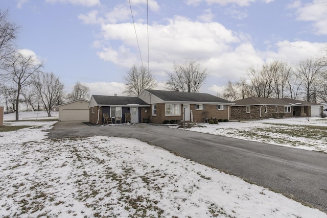 single story home with an outbuilding and a garage