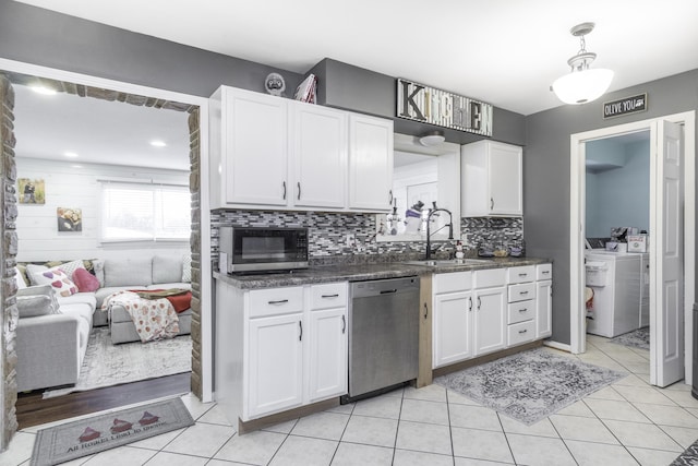 kitchen with white cabinetry, sink, tasteful backsplash, and stainless steel appliances