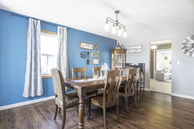 dining area with dark hardwood / wood-style floors