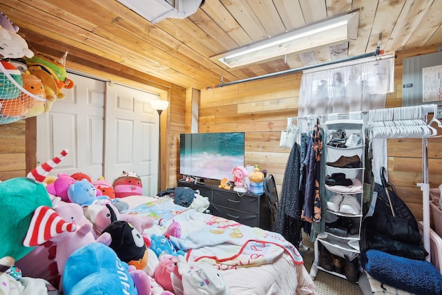 bedroom with wooden walls and wood ceiling