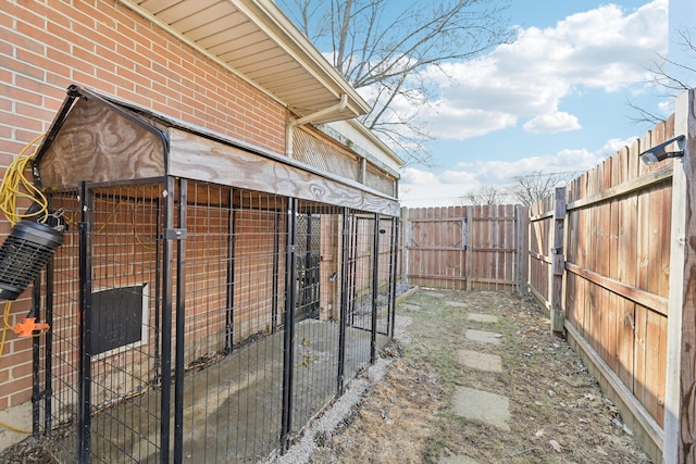 view of yard featuring an outdoor structure and a fenced backyard