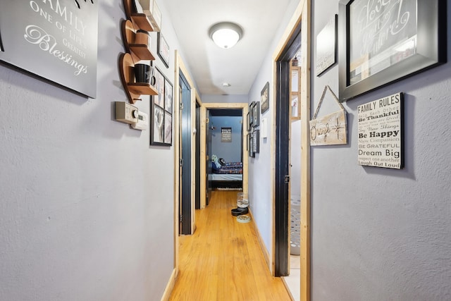 hall with wood finished floors