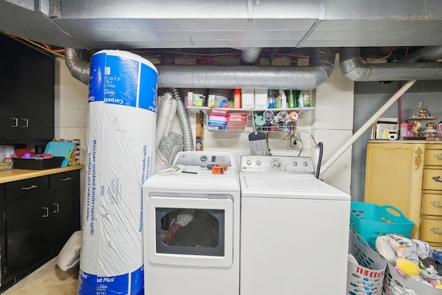 washroom featuring laundry area and separate washer and dryer