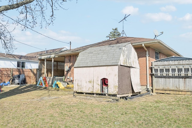 view of shed with fence