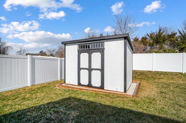 view of shed featuring a fenced backyard