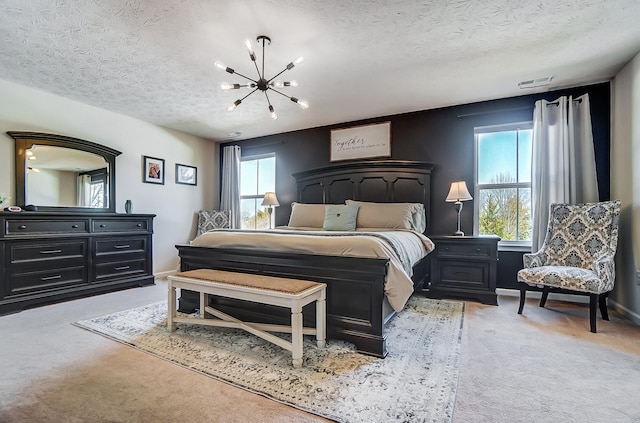 bedroom with visible vents, baseboards, light colored carpet, an inviting chandelier, and a textured ceiling