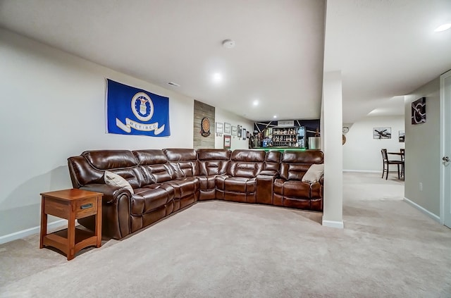 living area featuring recessed lighting, baseboards, and carpet flooring