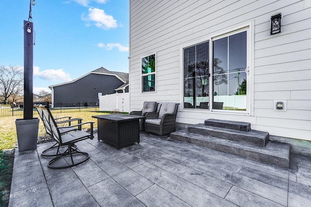 view of patio with entry steps and fence