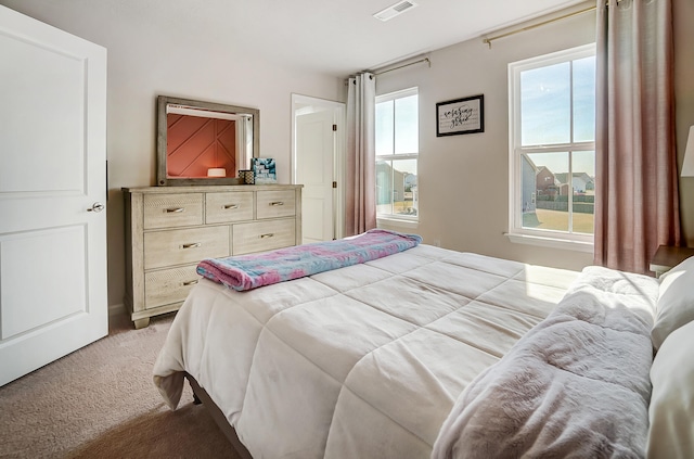 bedroom featuring visible vents and carpet floors