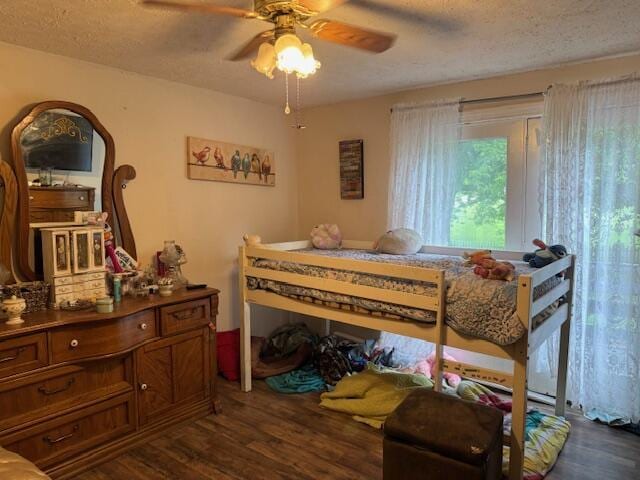 3862 Moorefield Rd, Springfield, OH 45502 - bedroom with dark wood-style floors, a textured ceiling, and ceiling fan