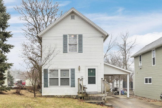 view of front of property with a carport