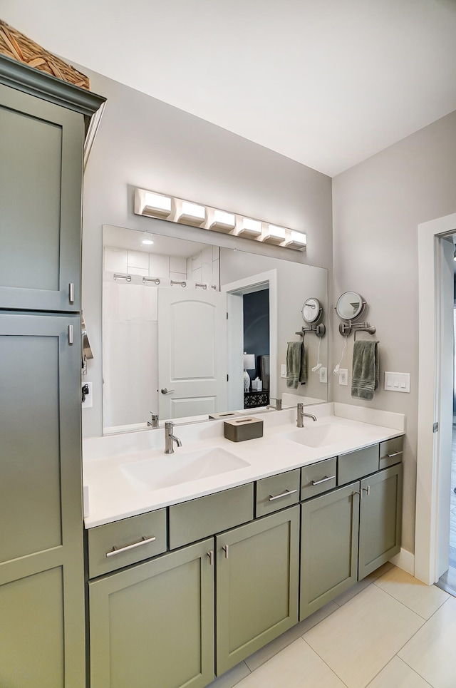 bathroom featuring tile patterned floors, vanity, and curtained shower