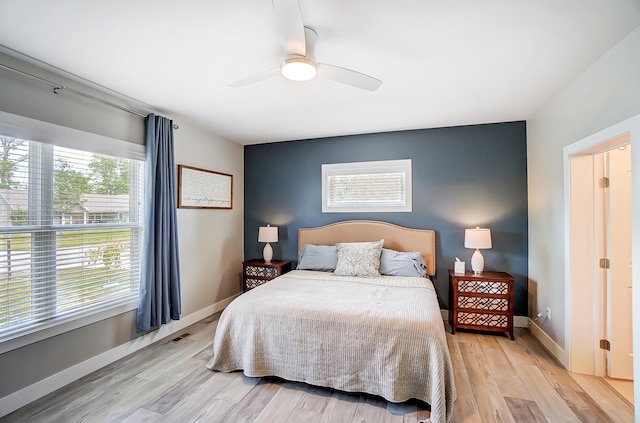 bedroom featuring ceiling fan and light wood-type flooring