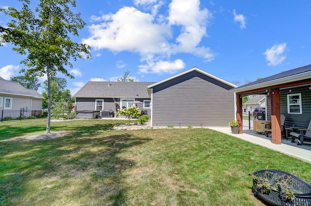 view of yard with a hot tub and a patio