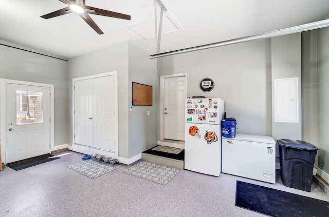 clothes washing area with ceiling fan, electric panel, and washer and dryer