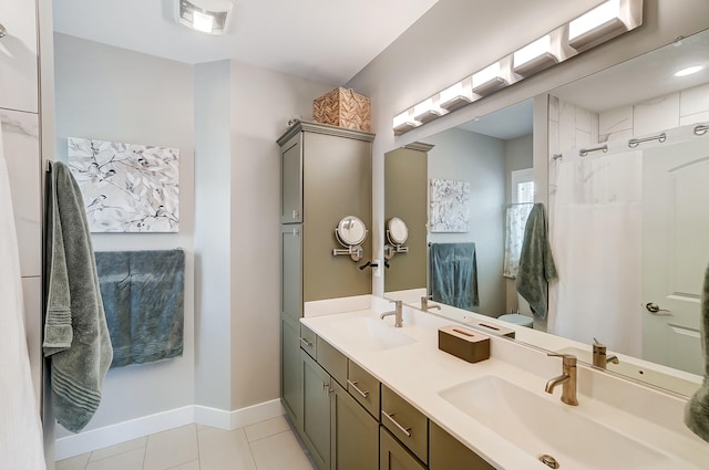 bathroom featuring vanity, tile patterned floors, and a shower