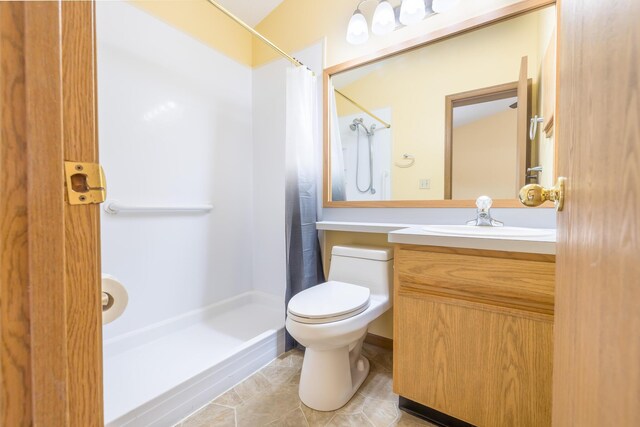 1534 Cross Pointe Cir, Bellefontaine, OH 43311 - bathroom featuring a shower with shower curtain, vanity, and tile patterned flooring