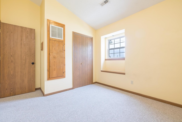 1534 Cross Pointe Cir, Bellefontaine, OH 43311 - unfurnished bedroom featuring lofted ceiling, carpet floors, and a closet