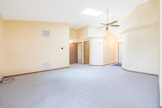 1534 Cross Pointe Cir, Bellefontaine, OH 43311 - unfurnished living room with ceiling fan, light carpet, high vaulted ceiling, and a skylight