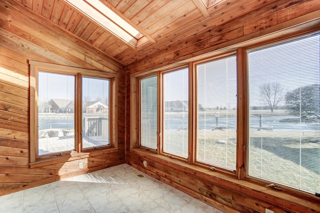 unfurnished sunroom featuring visible vents, lofted ceiling with skylight, and wood ceiling