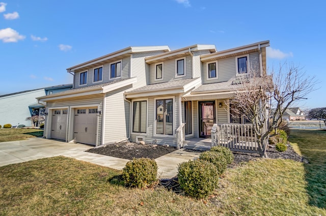 view of property with an attached garage, covered porch, concrete driveway, and a front yard