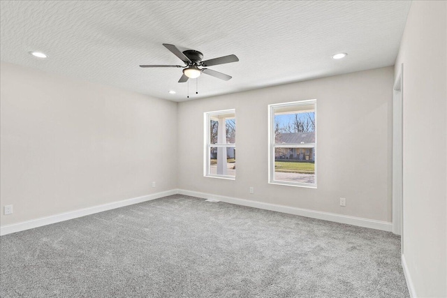 carpeted empty room with baseboards, recessed lighting, a textured ceiling, and ceiling fan