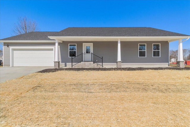 view of front facade with a garage, roof with shingles, covered porch, and driveway