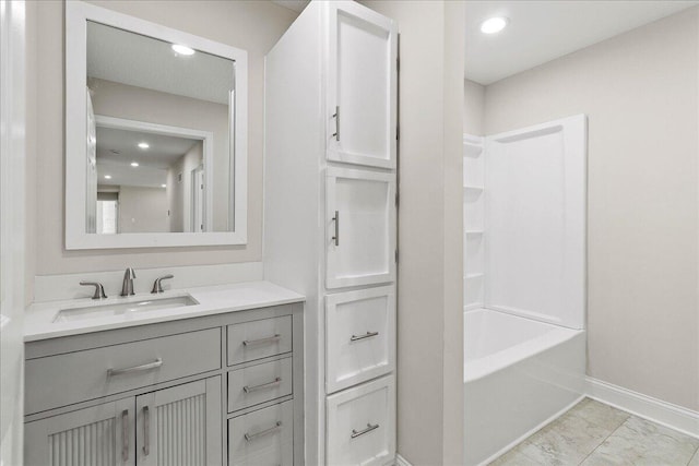 full bathroom featuring vanity, recessed lighting, and baseboards