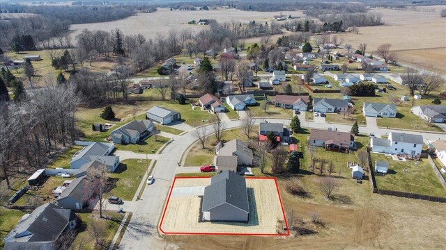 birds eye view of property with a residential view